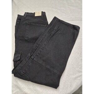 Black straight leg jeans with cargo pockets.